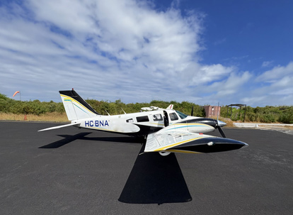 Light aircraft on Isabela Island landing strip.